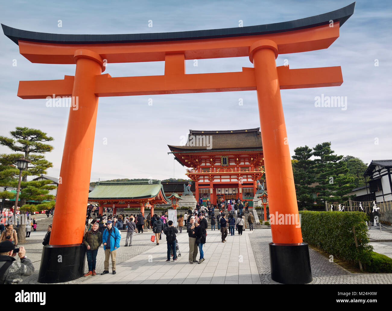Torii in front of the Main gate, Romon, busy with tourists at Fushimi Inari Taisha head shrine in Fushimi Ward, Kyoto, Japan 2017 Stock Photo