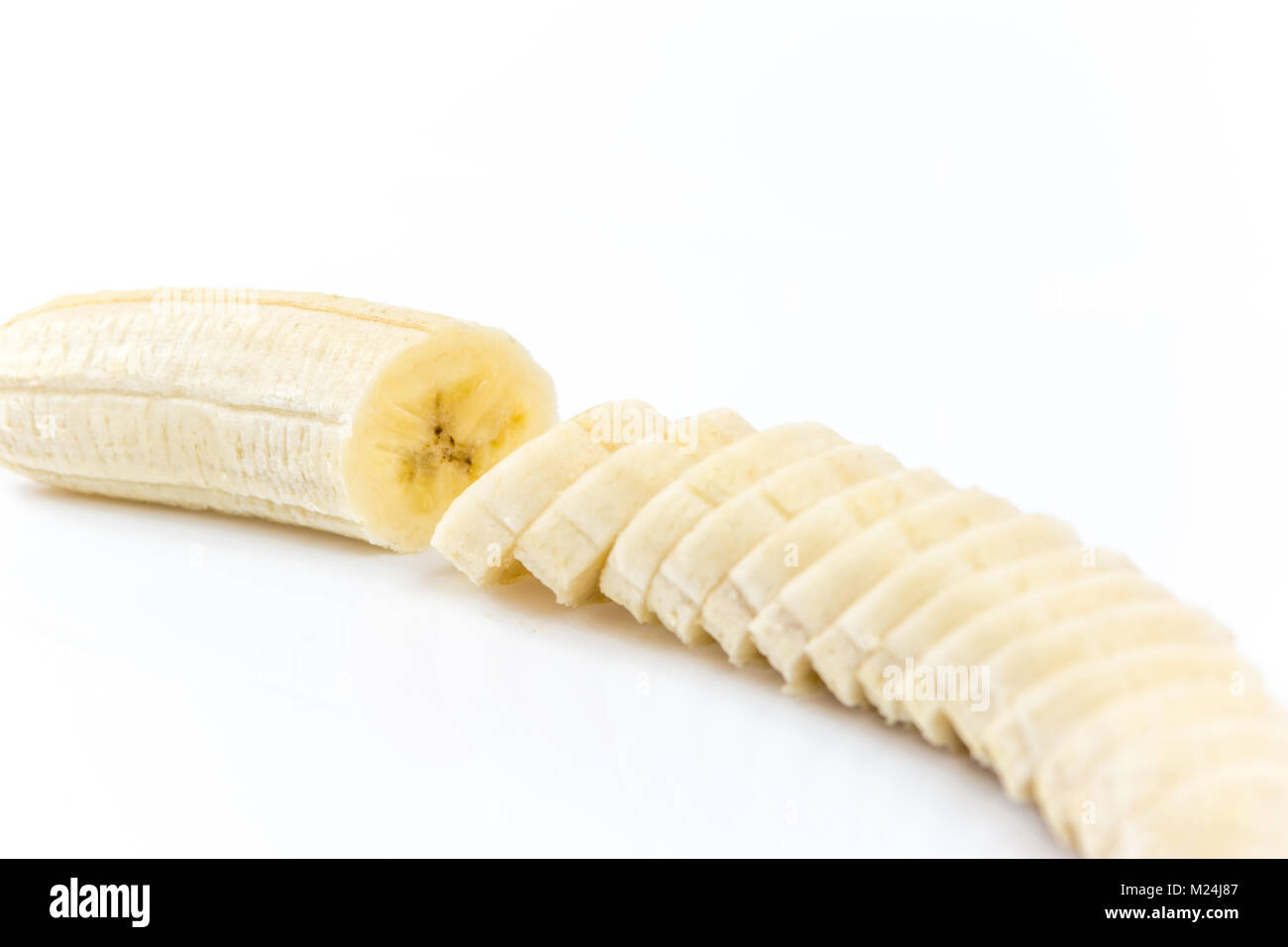 Cuts of banana without peel isolated on white background Stock Photo