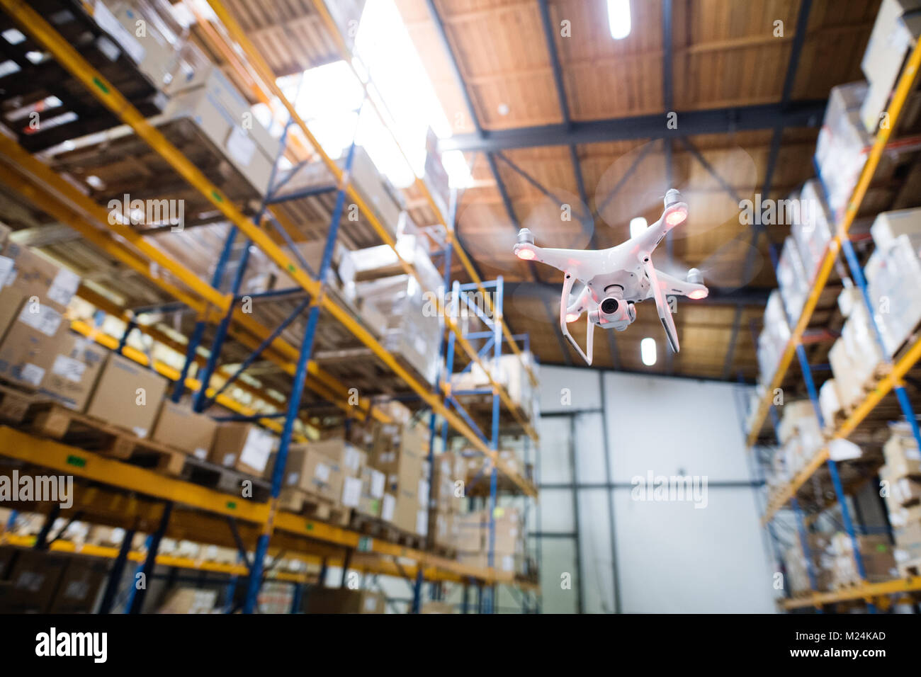 Drone flying inside the warehouse. Stock Photo