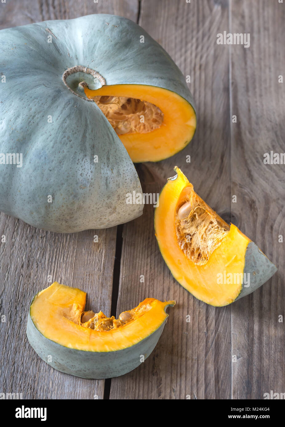 Ripe pumpkin on the wooden background Stock Photo - Alamy