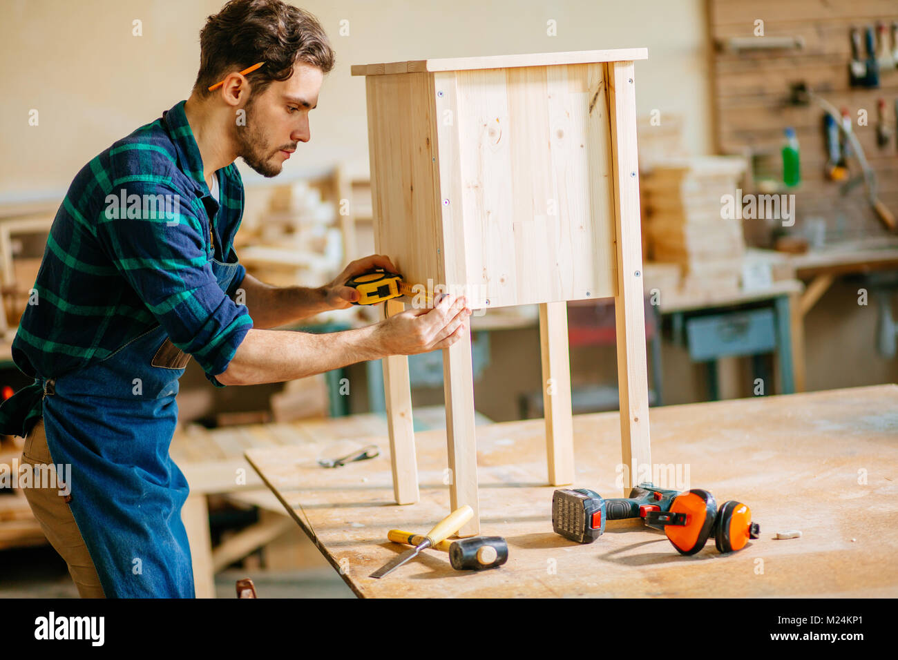 carpenter working in his woodwork or workshop Stock Photo