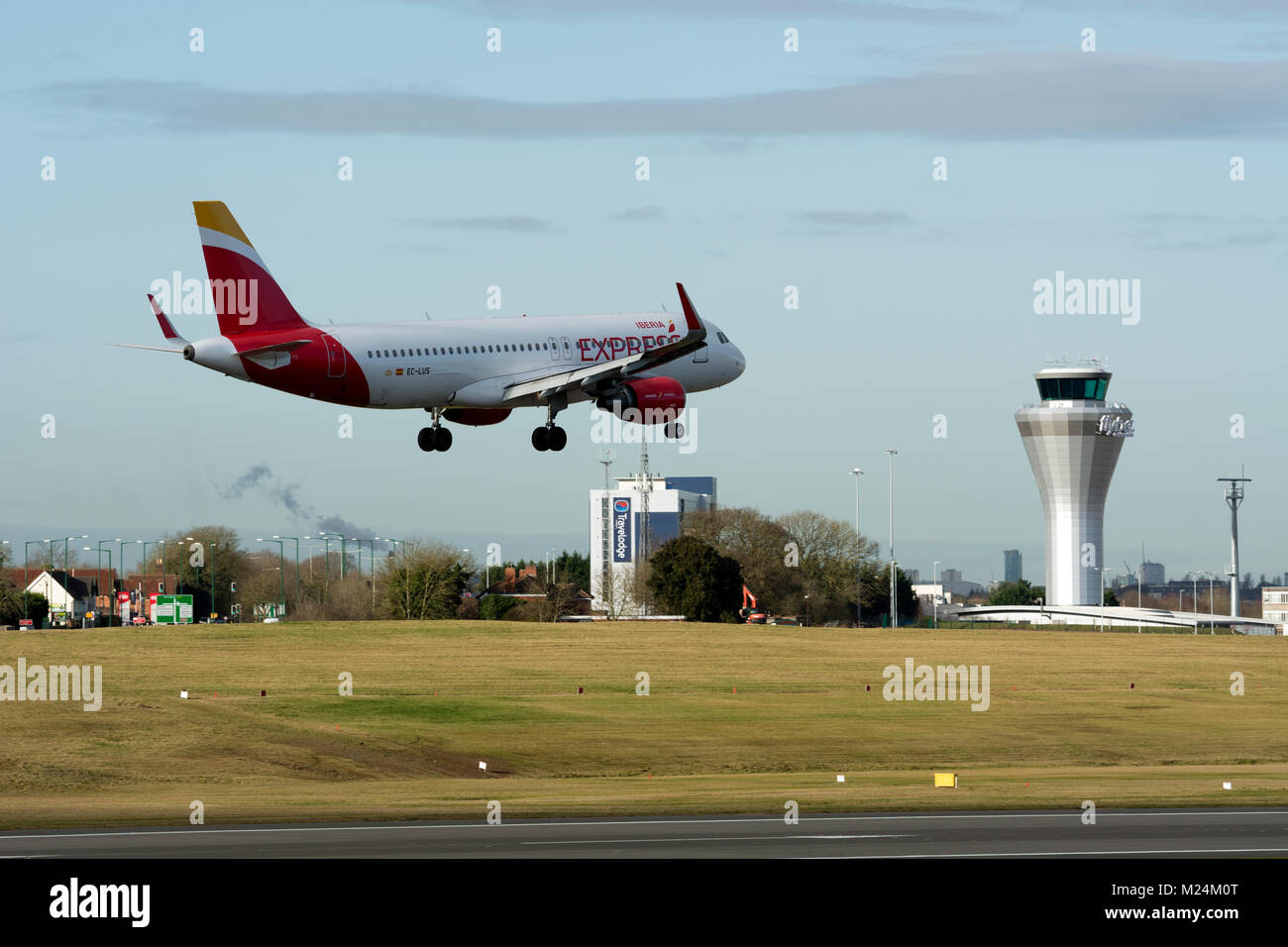Iberia Express Airbus A320 landing at Birmingham Airport, UK. (EC-LUS) Stock Photo