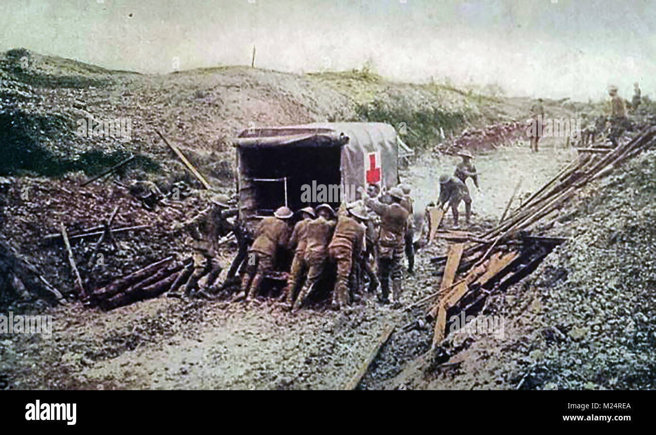 First World War (1914-1918)  aka The Great War or World War One - Trench Warfare - WWI   British forces pushing a field ambulance through mud and rubble (From a WWI postcard) Stock Photo