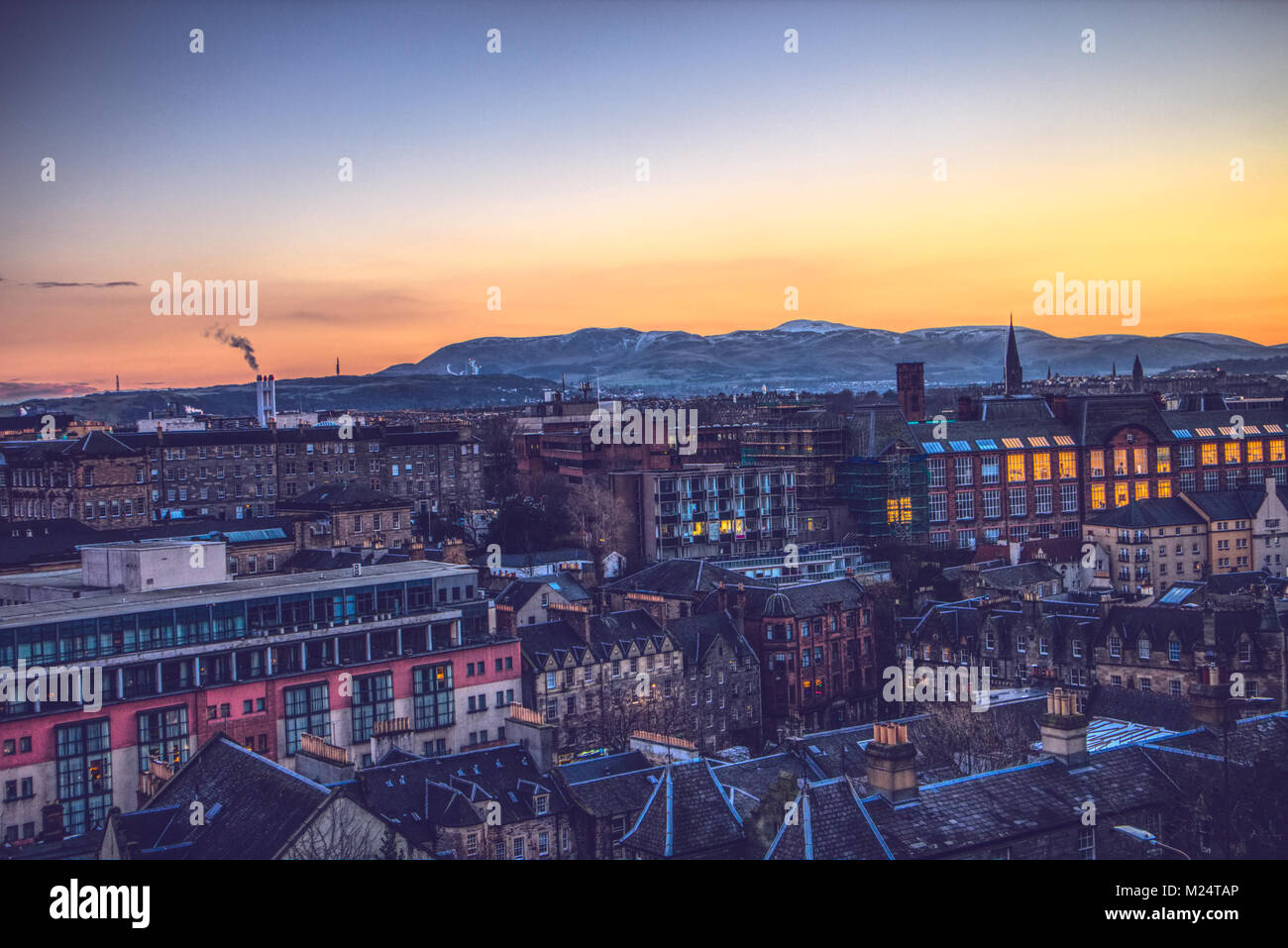A sunset view of Edinburgh and the Pentland Hills, taken from the esplanade of Edinburgh Castle, Scotland, UK Stock Photo