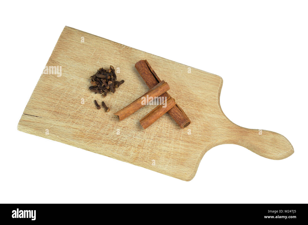 Cloves and cinnamon on wooden board isolated Stock Photo Alamy