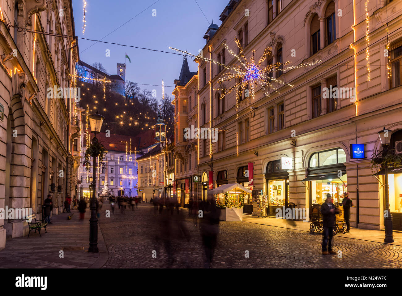 Sritar street with Ljubljana Castle in the background adorned with Christmas lights, Ljubljana, Slovenia Stock Photo