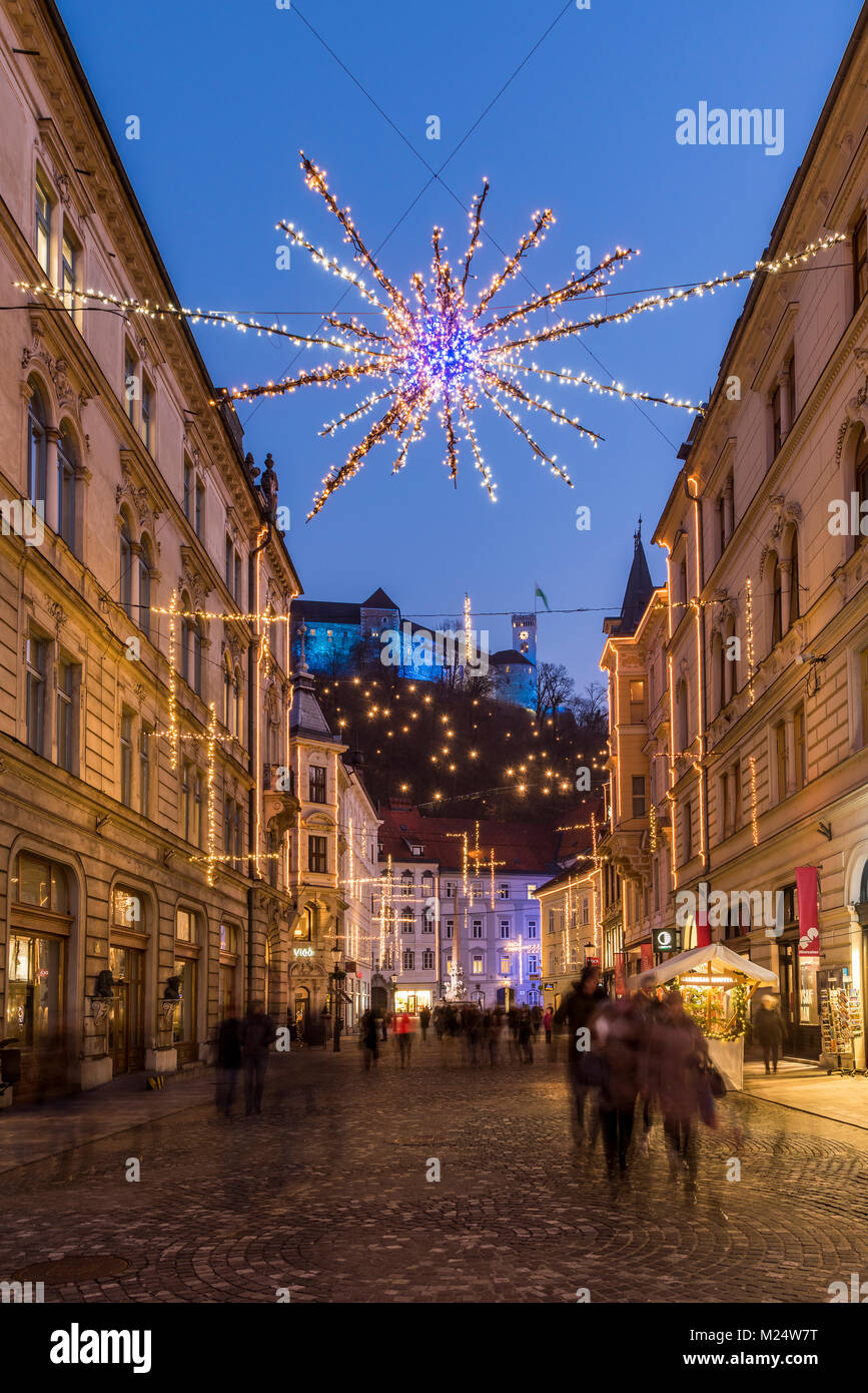 Sritar street with Ljubljana Castle in the background adorned with Christmas lights, Ljubljana, Slovenia Stock Photo