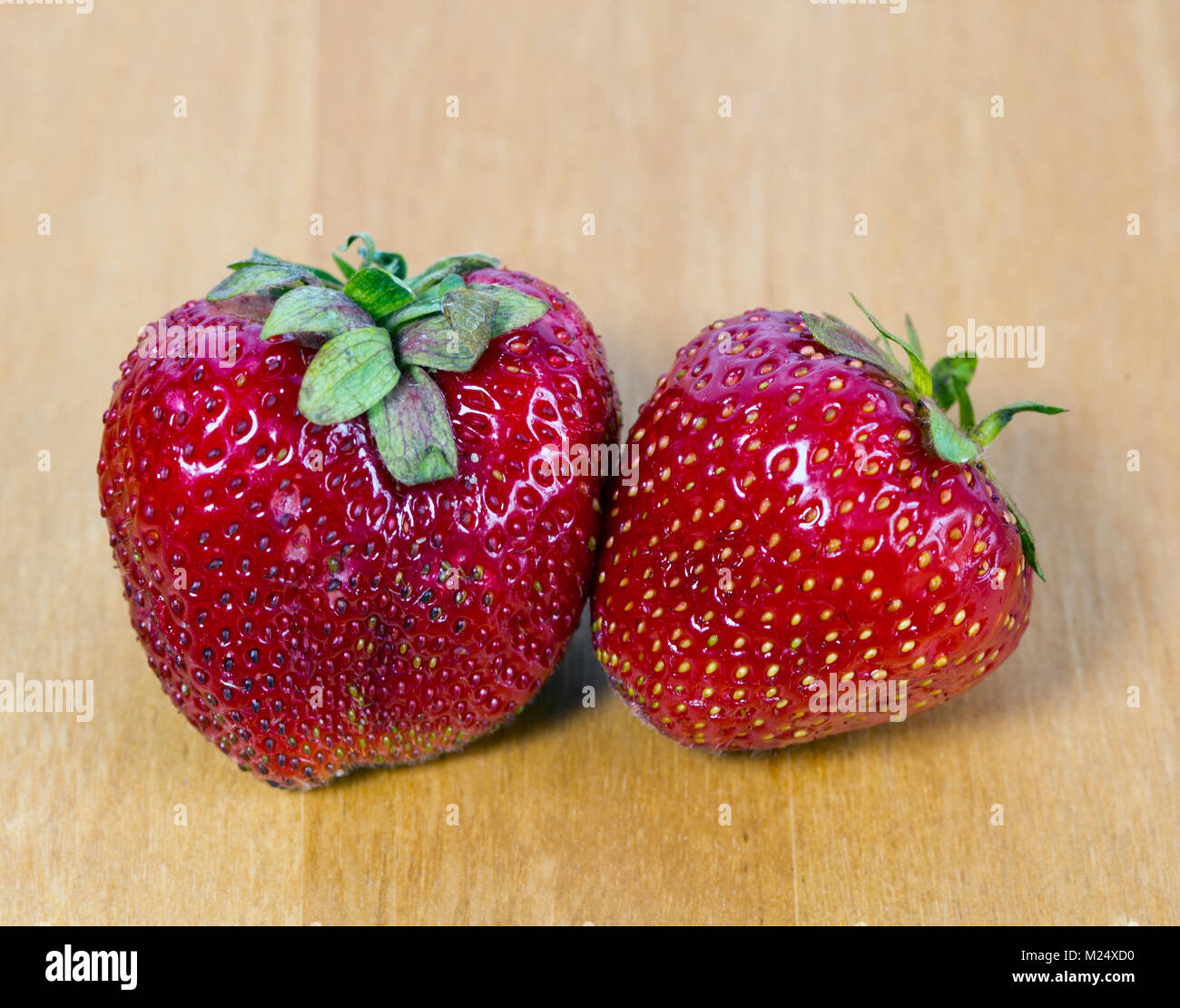 Two red ripe strawberry hi-res stock photography and images - Alamy