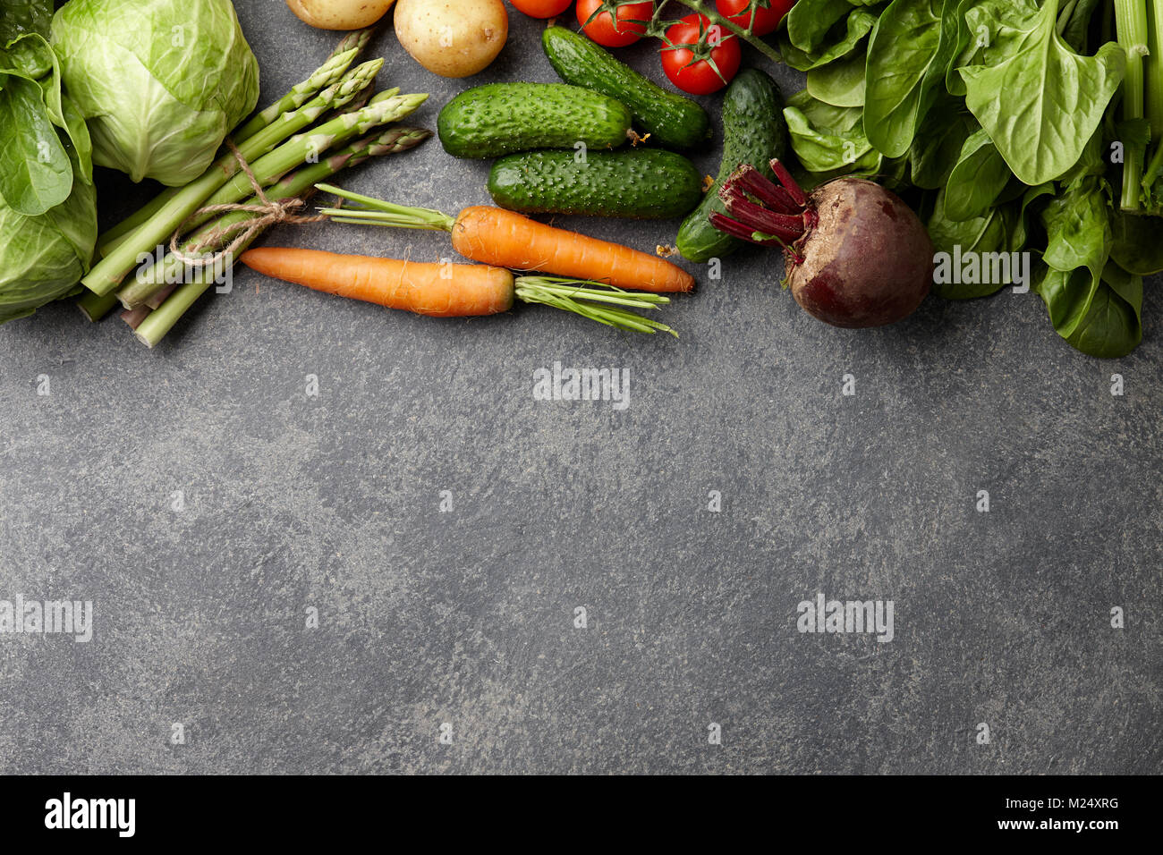 Fresh spring vegetables cooking in the kitchen, top view Stock Photo ...