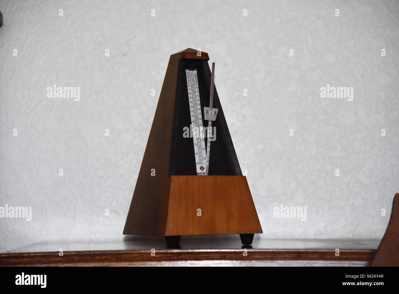 Metronome on piano Stock Photo Alamy