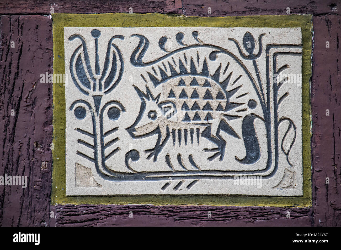 facade paintings at half-timbered house in old town of Alsfeld, Hesse, Germany, animal motif hedgehog Stock Photo