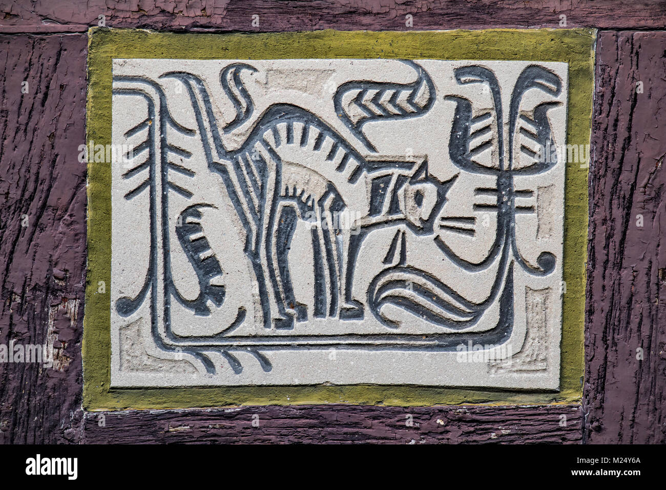 facade paintings at half-timbered house in old town of Alsfeld, Hesse, Germany, animal motif cat Stock Photo