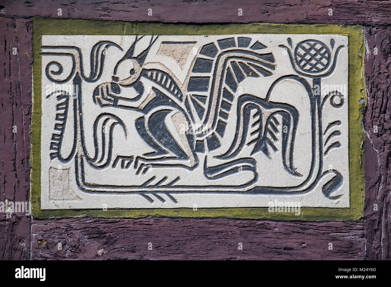 facade paintings at half-timbered house in old town of Alsfeld, Hesse, Germany, animal motif squirrel Stock Photo