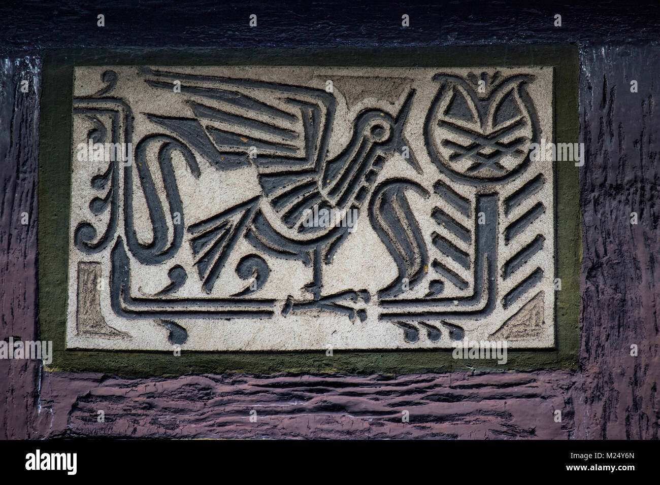 facade paintings at half-timbered house in old town of Alsfeld, Hesse, Germany, animal motif bird Stock Photo