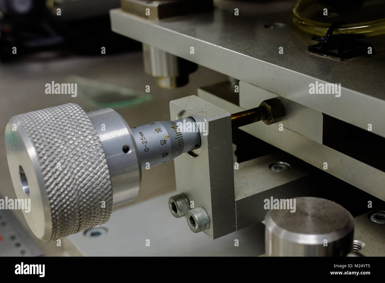 Using a Micrometer With machine, Or high resolution work and setup on machine for electronic industry. Stock Photo