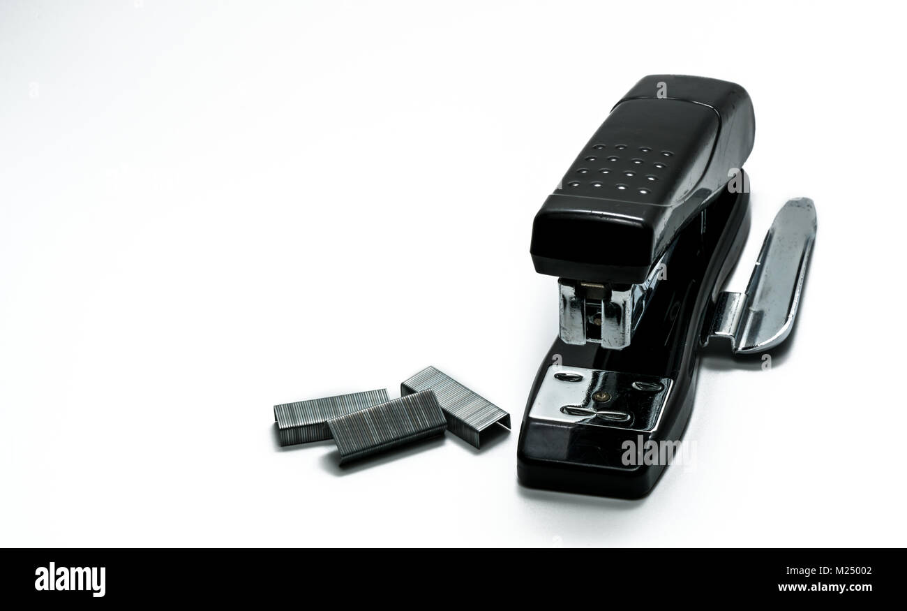 Black stapler and staples that have been used in the office for a long