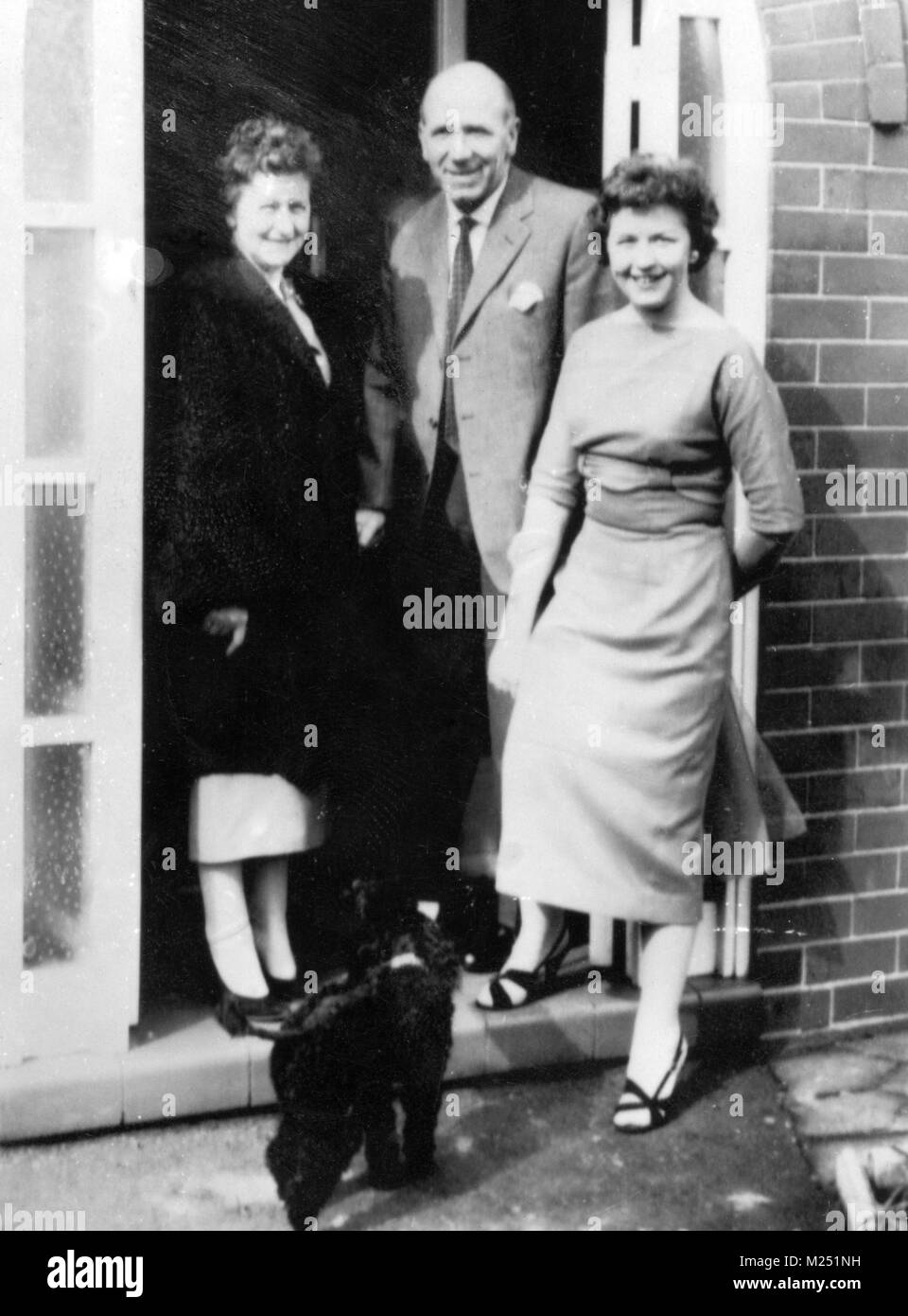 File photo dated 18-04-1958 of Manchester United manager Matt Busby at his home in the city, after returning from Munich. He has been recovering from injuries sustained in the Munich air disaster that claimed the lives of eight of his team. With him are his wife Jean and daughter Sheena. Stock Photo