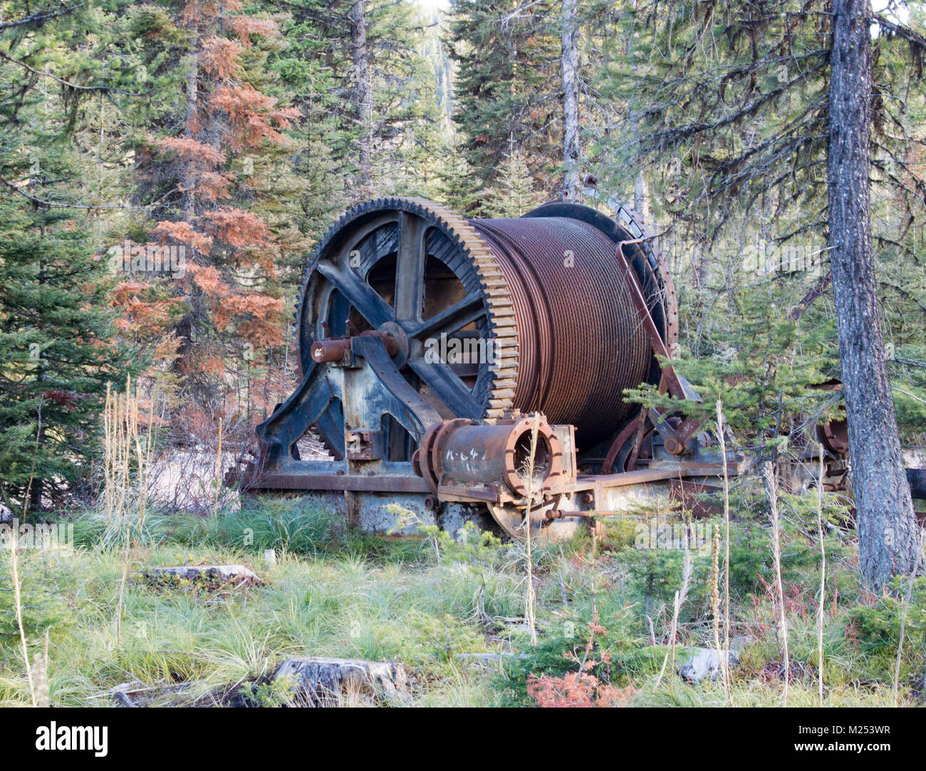 Remnants of an old steam powered mine shaft cable winch, outside of Garnet Ghost Town, on Bear Gulch, northwest of Drummond, Montana. Stock Photo