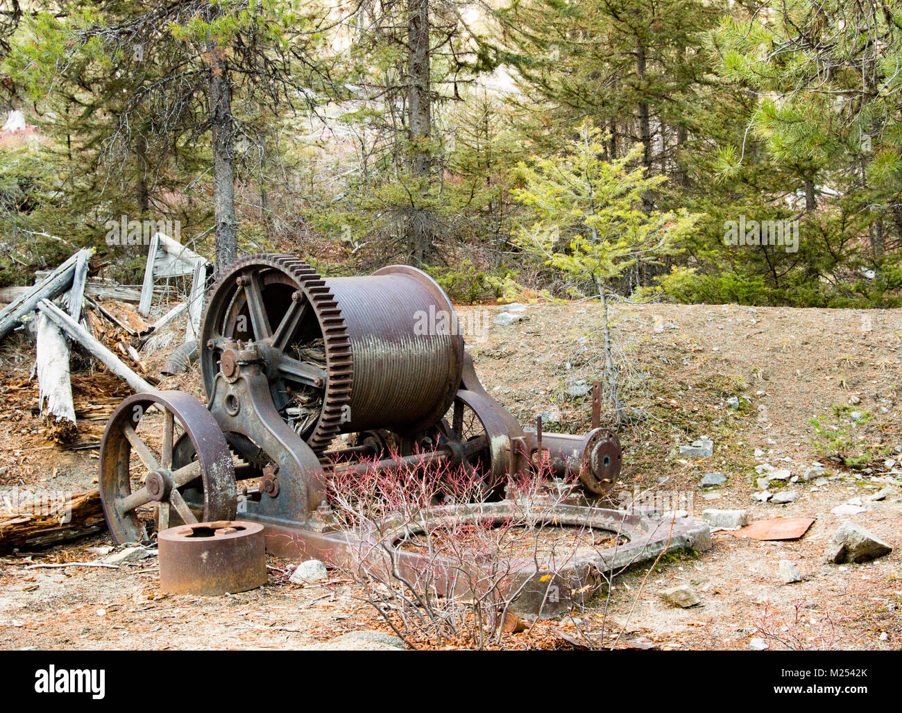 Remnants of an old steam powered mine shaft cable winch, outside of Garnet Ghost Town, on Bear Gulch, northwest of Drummond, Montana. Stock Photo