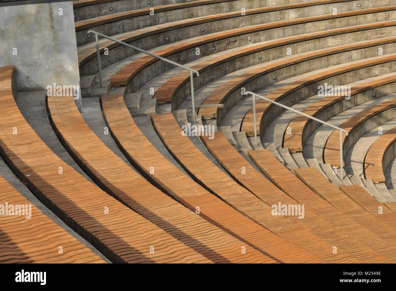 Amphitheater. Wooden benches set in stone circle. Stock Photo