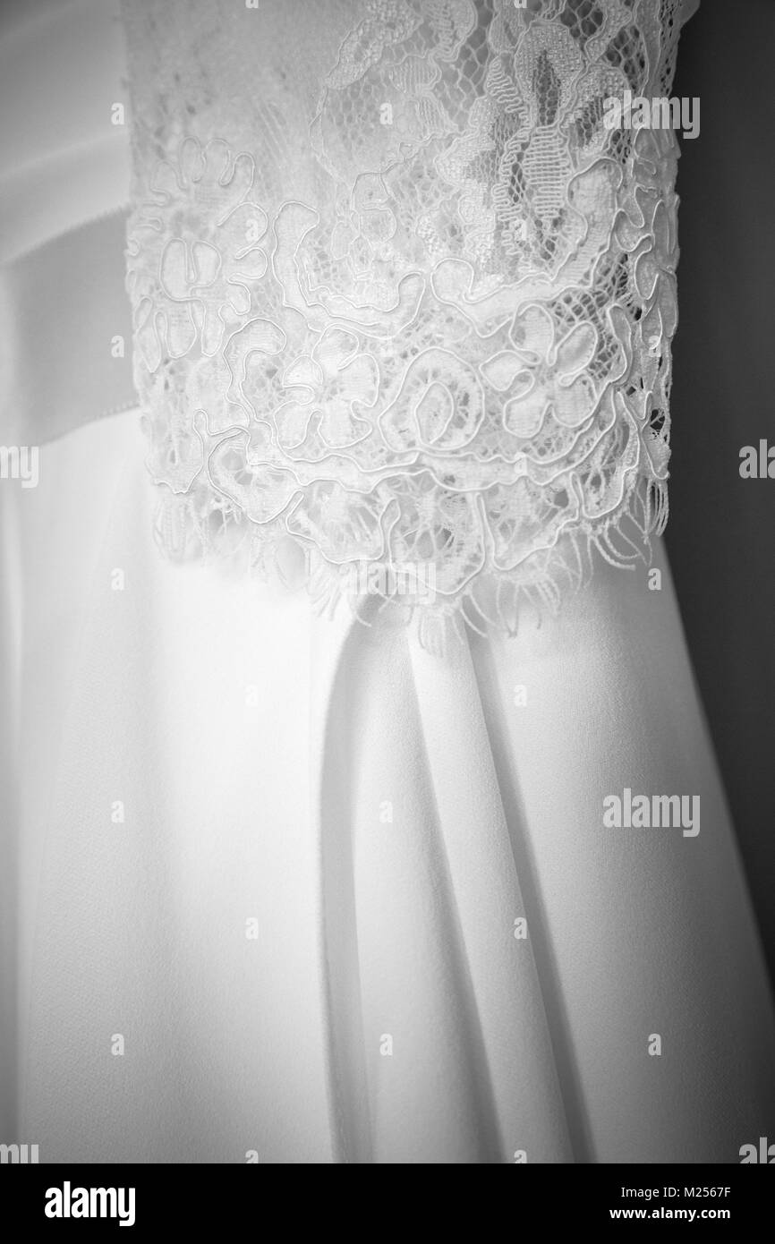 White lace wedding dress, black and white, close up Stock Photo
