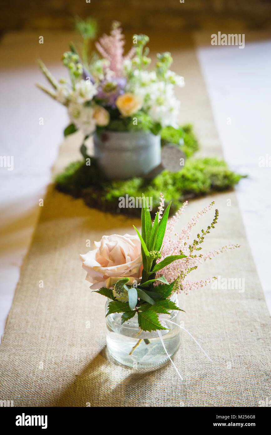 Floral arrangements on wedding reception table Stock Photo
