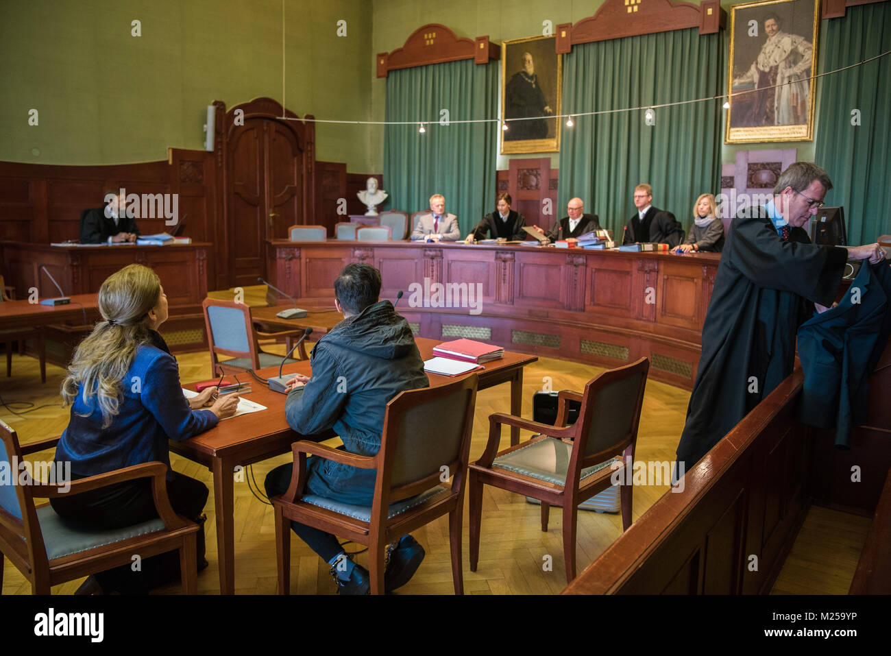 Bayreuth, Germany. 05th Feb, 2018. A Syrian terrorism suspect (2.f.l) and his lawyer Jochen Ringler (r) in the courtroom before the start of the trial at the Landgericht (regional court) in Bayreuth, Germany, 05 February 2018. The trial of the 19-year-old Syrian, who was arrested in Pegnitz in June, has begun. The defendant is accused of planning an act of terrorism. Credit: Nicolas Armer/dpa/Alamy Live News Stock Photo