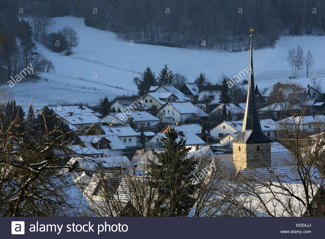 Bavaria, Germany. 5th February, 2018. Early morning light falls on a church spire in Bavaria, Germany, after a night of light snowfalls. More light snow is forecast for Tuesday and Wednesday. Credit: reallifephotos/Alamy Live News Stock Photo