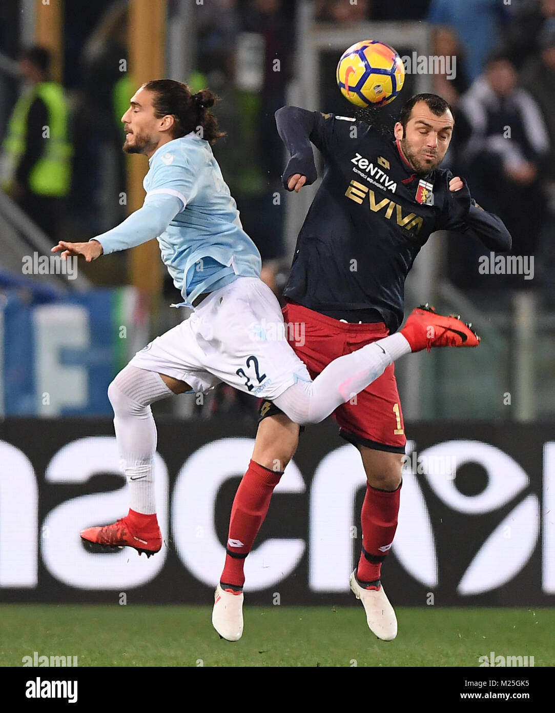 Roma, Italy. 5th Feb, 2018. Lazio's Martin Caceres(L) competes with Genoa's Goran Pandev during a Serie A soccer match between Lazio and Genoa in Rome, Italy, Feb. 5, 2018. Genoa won 2-1. Credit: Alberto Lingria/Xinhua/Alamy Live News Stock Photo