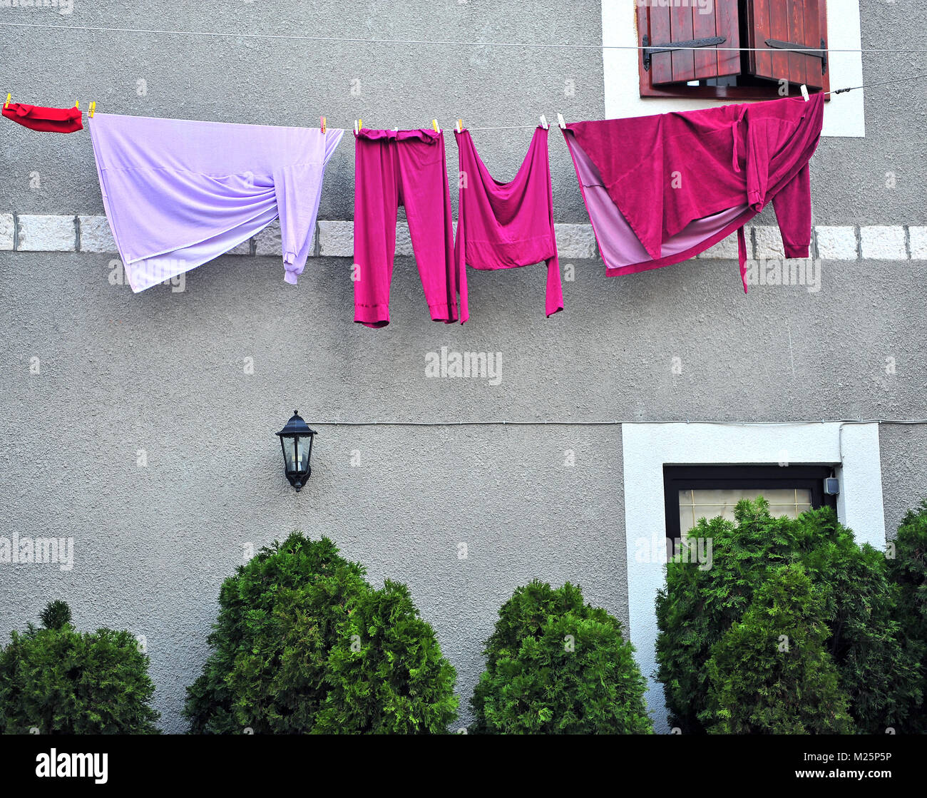 Hanging clothes on the rope of a modern house Stock Photo