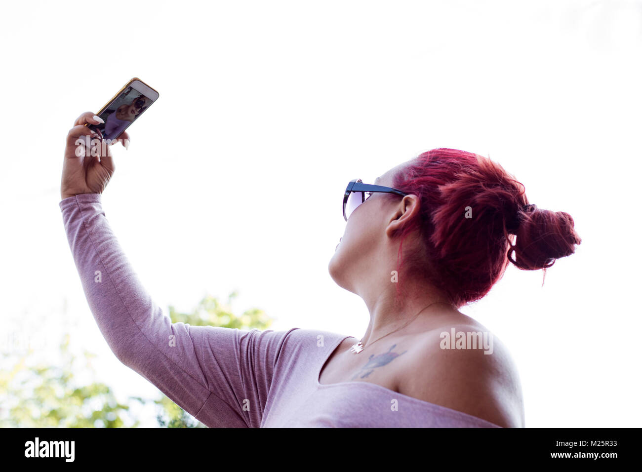 Young girl taking selfie with her smart phone outdoor Stock Photo - Alamy