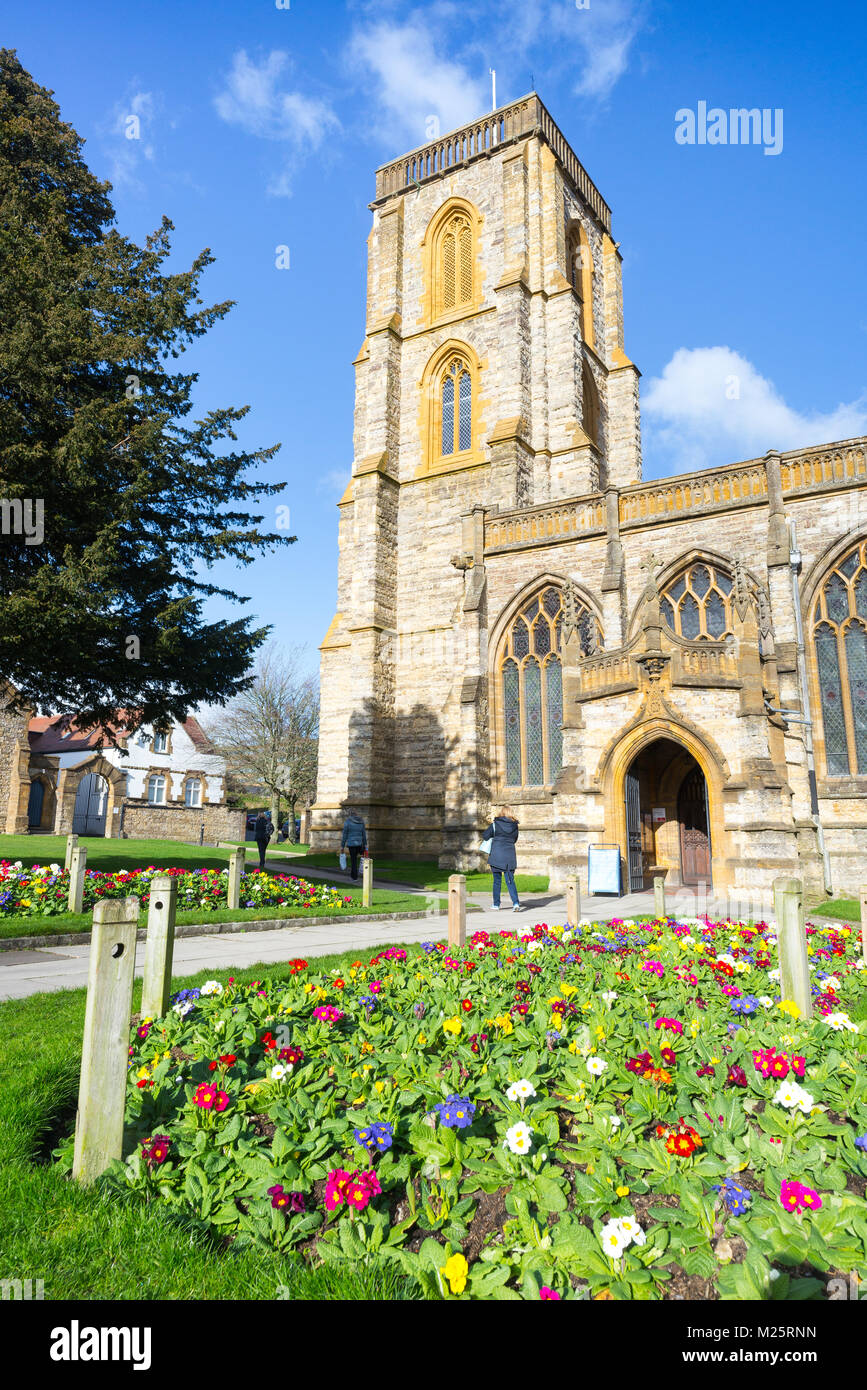 Spring flowers in front of the church of St John's in Yeovil, Somerset, UK Stock Photo