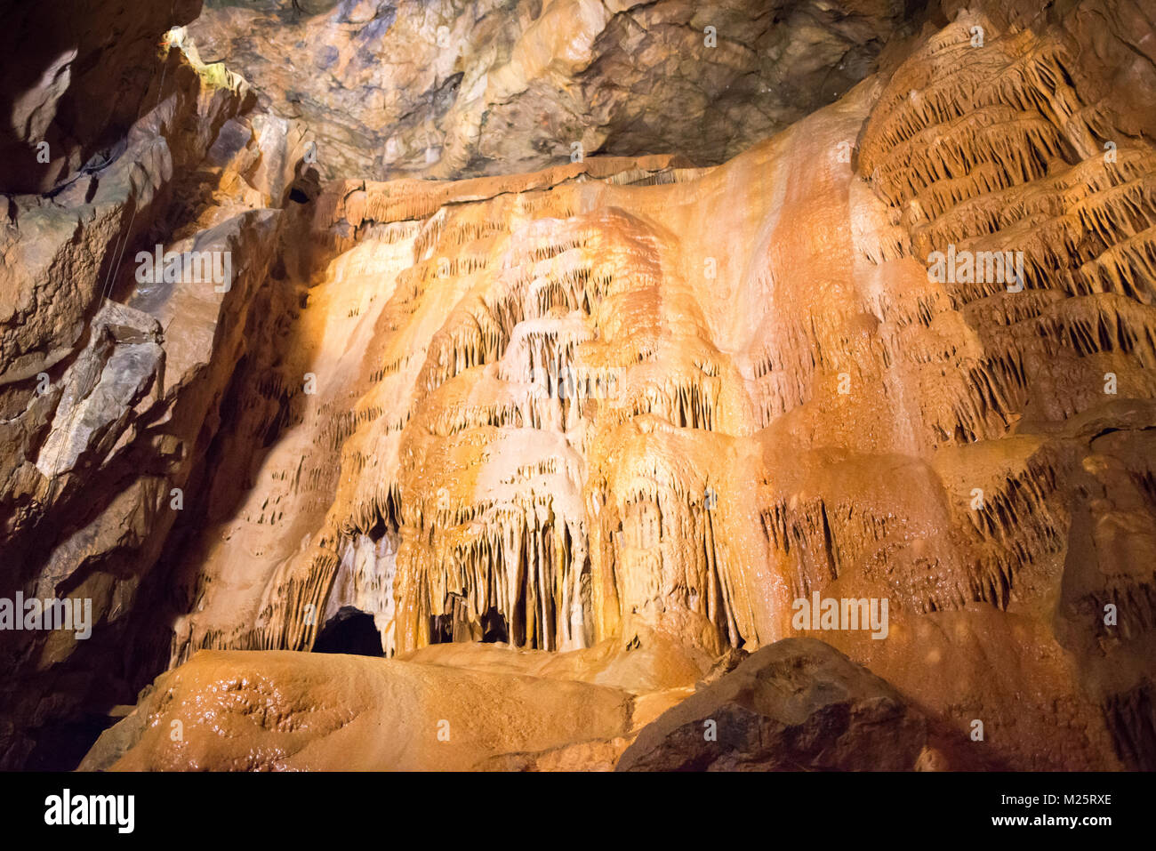 Limestone rock formation featuring a cascade of stalactites In Gough's Cave, Cheddar Gorge, Mendip Hills, Somerset, UK Stock Photo