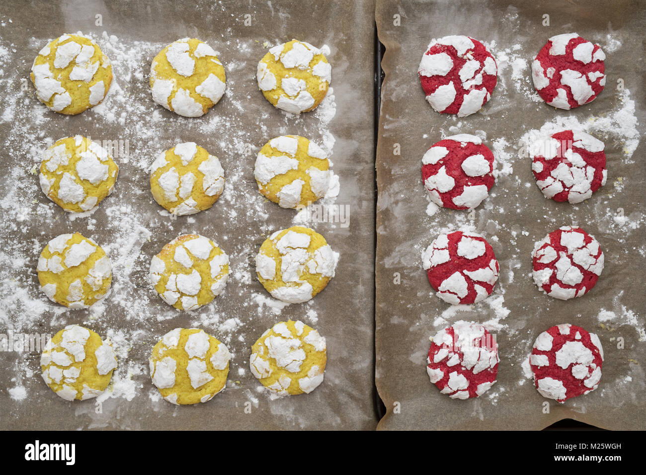 Homemade Lemon and Raspberry Crinkle Cookies on baking sheets. UK Stock