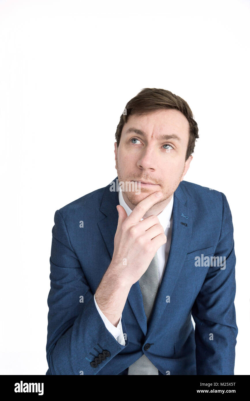 Portrait Of A Smartly Dressed Man With His Hand On His Chin Like He Is