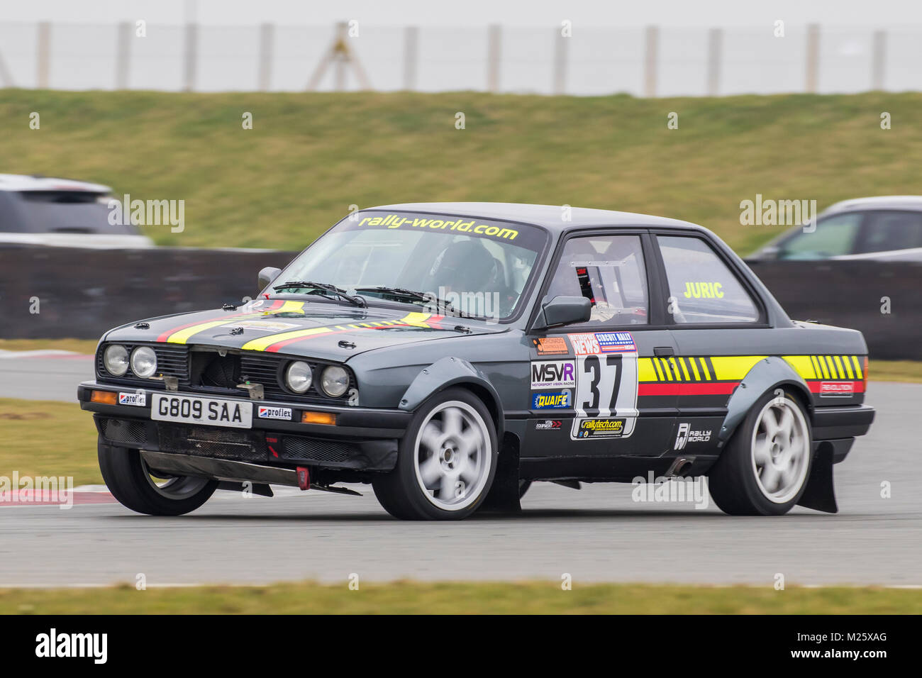 BMW E30 with driver Andrew Juric and co-driver Michael Juric at the Motorsport News Circuit Rally Championship, Snetterton, Norfolk, UK. Stock Photo