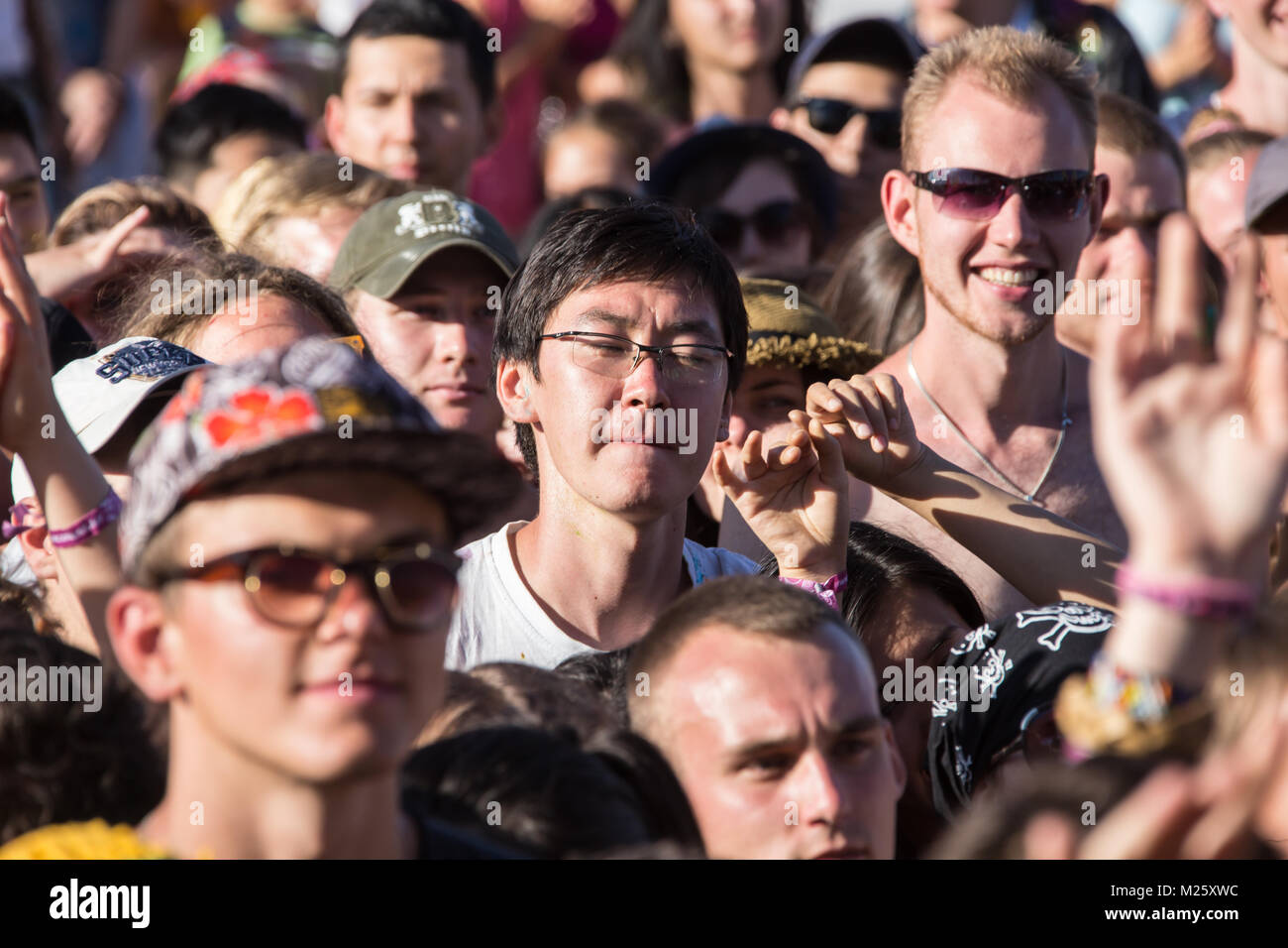 Cosmos Village, Almaty Province, Kazakhstan - 16 August 2015: The festival of ethnic music Forey, a lot of people gathers on this holiday to relax and have  fun. Ethnic open-air concert, where many people gathered. Crowd of blurred people Stock Photo