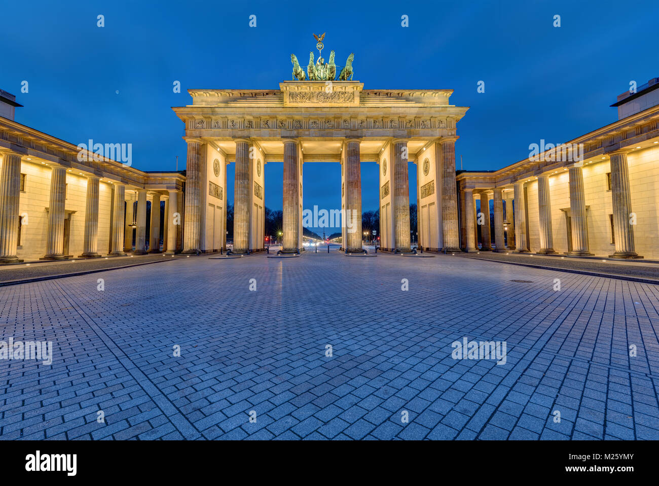The famous Brandenburg Gate in Berlin illuminated in the early morning