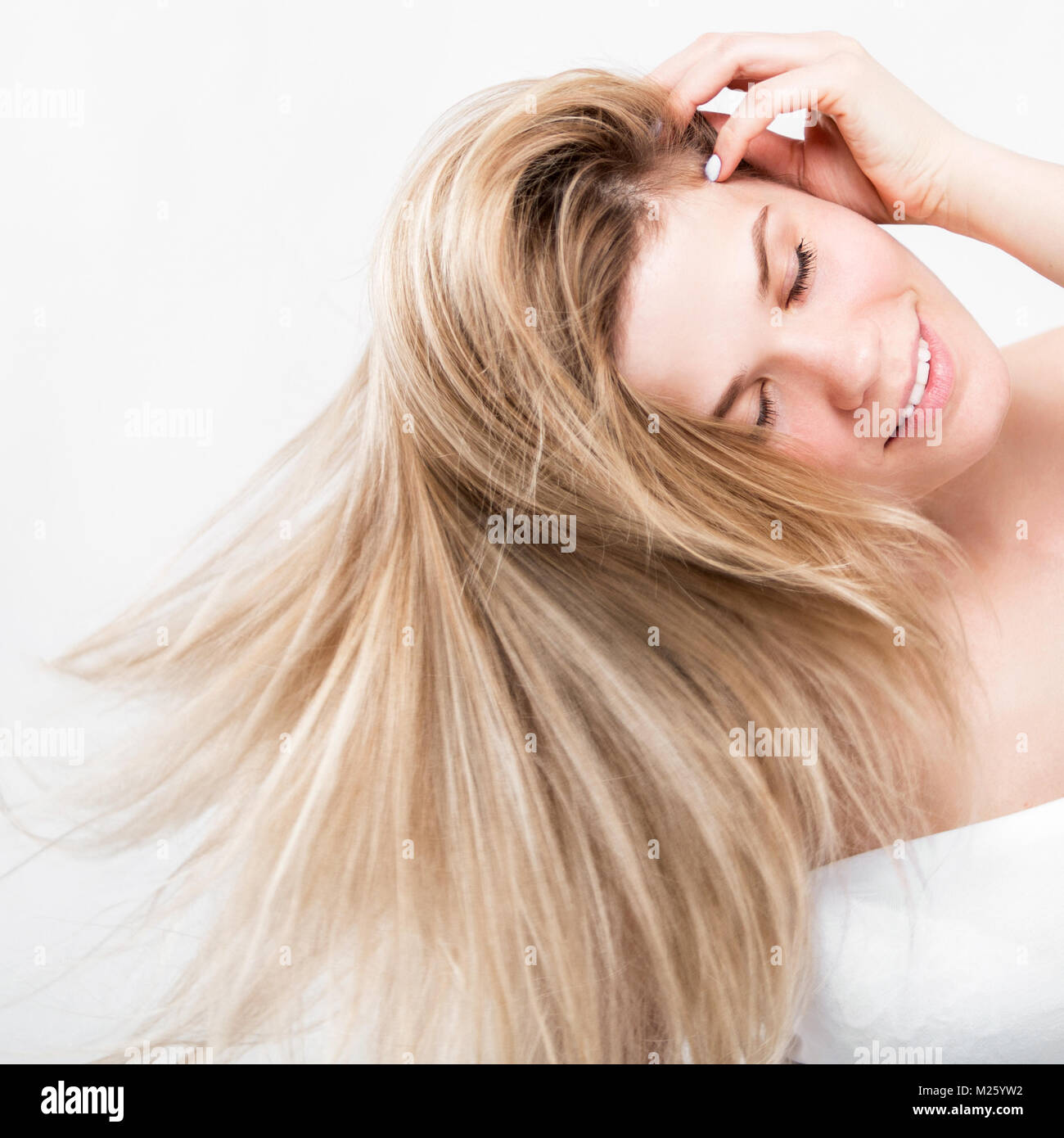 Portrait of a beautiful young woman with luxurious long hair Stock Photo