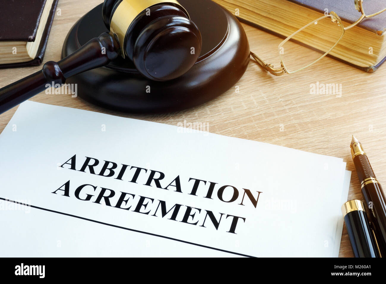 Arbitration agreement resolution of commercial disputes on a desk. Stock Photo