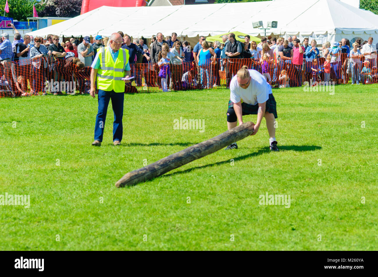 Male prepares to compete in tossing the caber competition at the