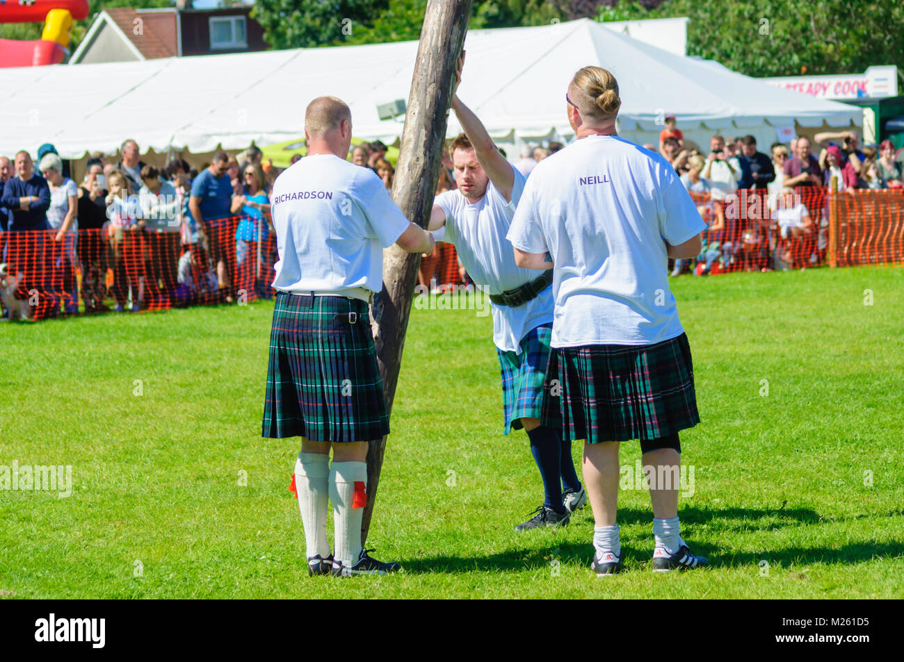 Male prepares to compete in tossing the caber competition at the
