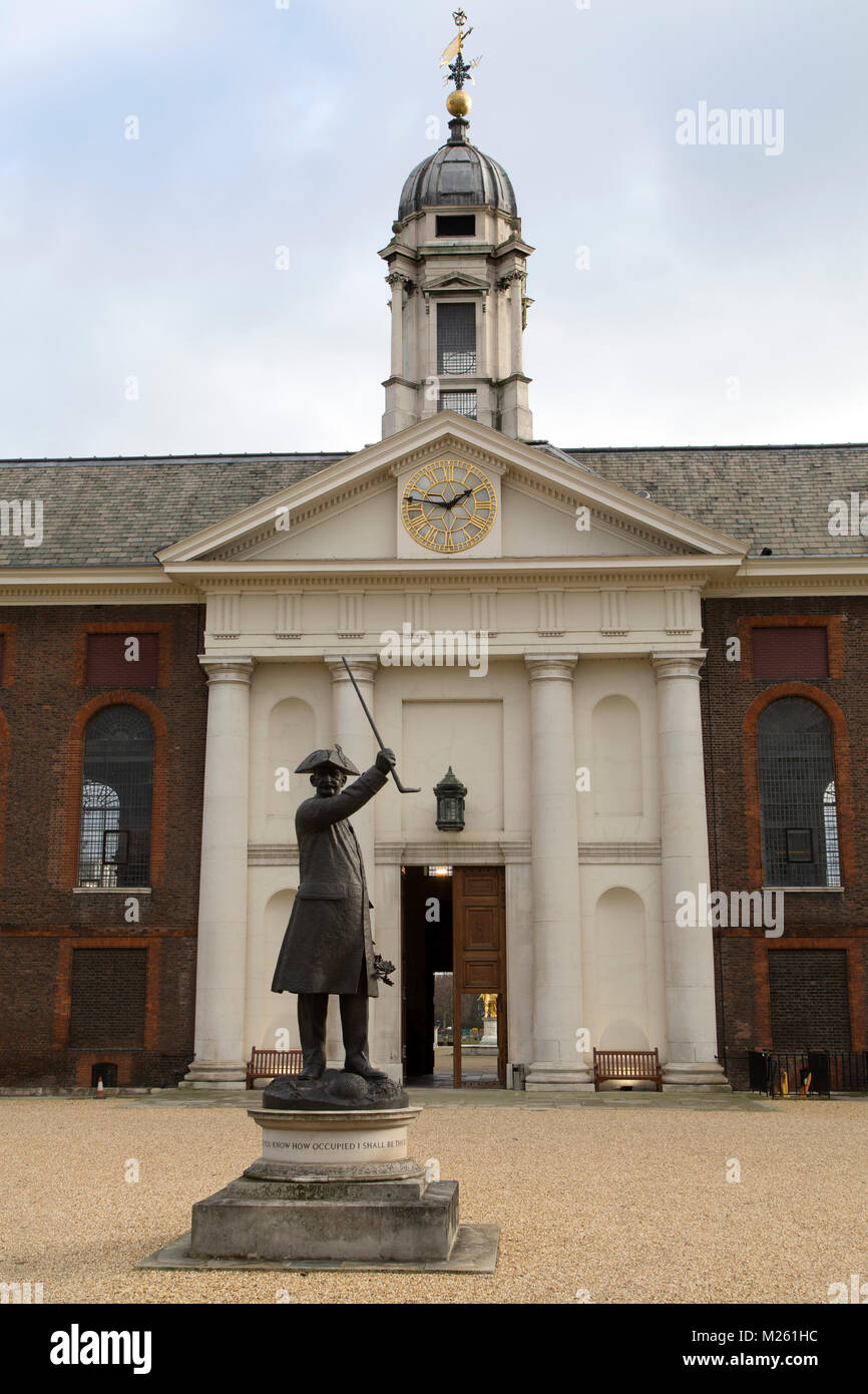 Statue of a Chelsea Pensioner outside of the Royal Hospital Chelsea in London, England. The bronze statue is depicted with a tricorn hat and cane. Stock Photo
