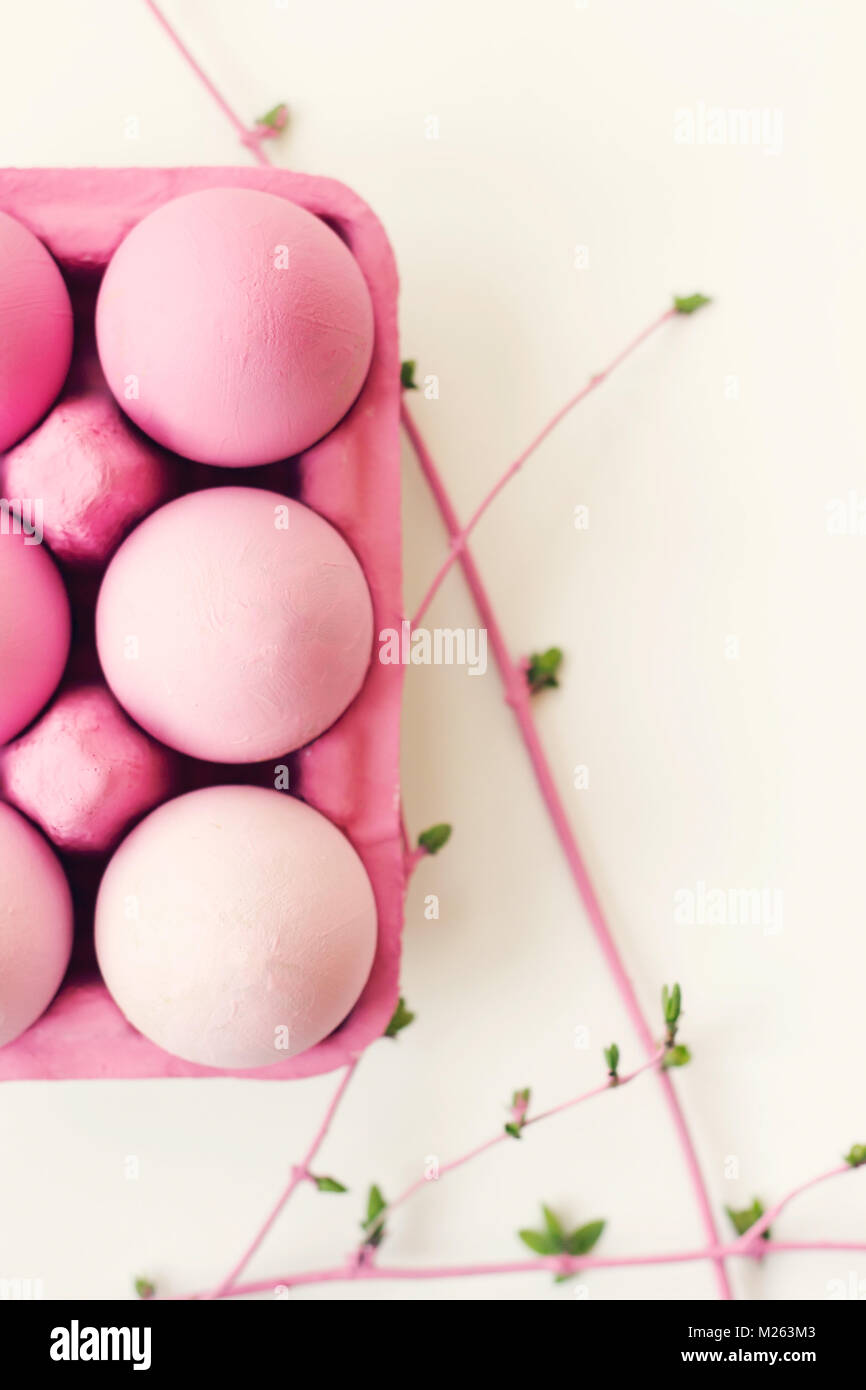 Decorative pink easter eggs in pink box on white background with copy ...