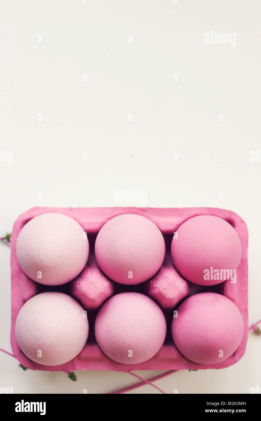 Pink easter eggs in pink box, on white background, with copy space ...