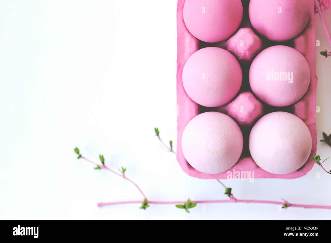 Decorative pink easter eggs in pink box on white background with copy ...