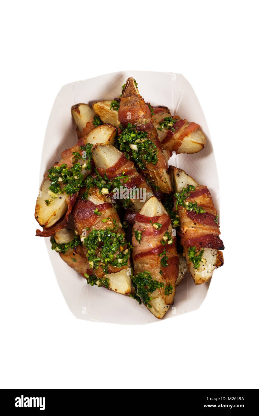 Bacon Wrapped Potatoes Wedges with Parsley Garlic Pesto Sauce Isolated