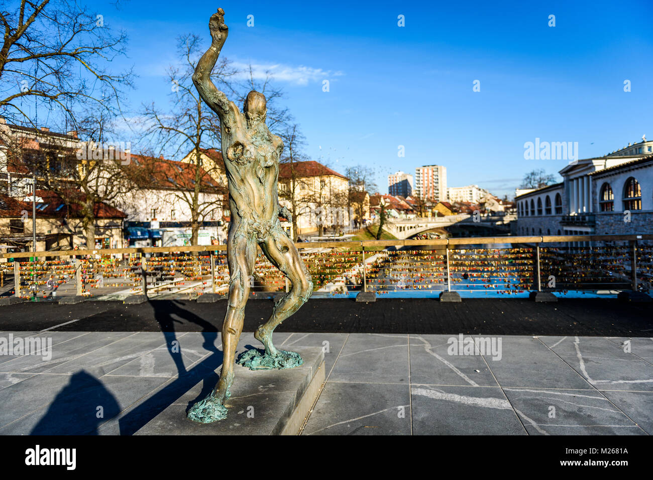 Statue of Prometheus on Butchers' bridge over river Ljubljanica ...
