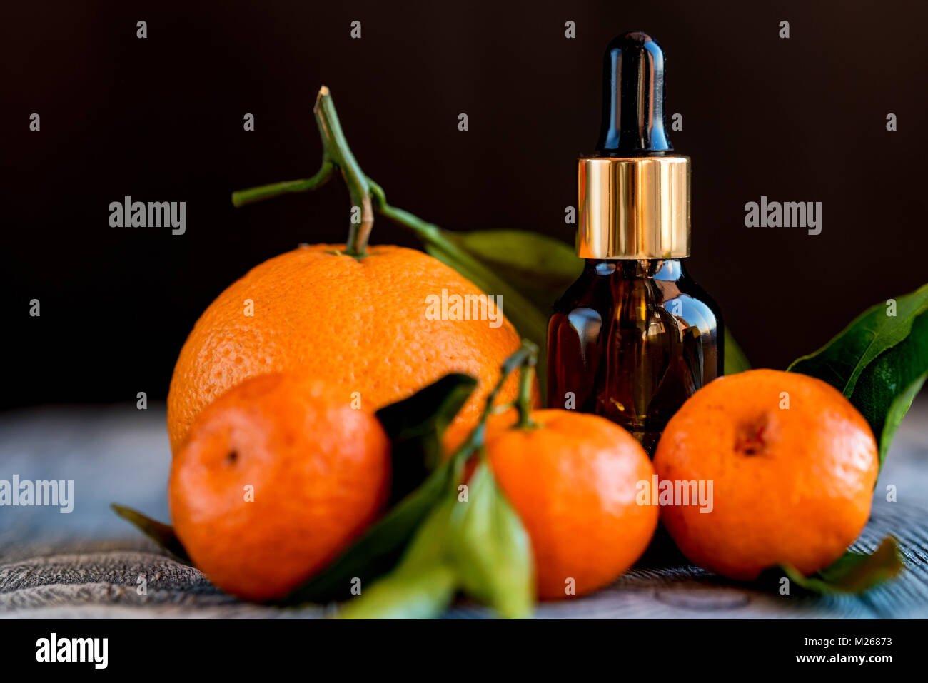 Dropper bottle of mandarin essential oil Stock Photo Alamy