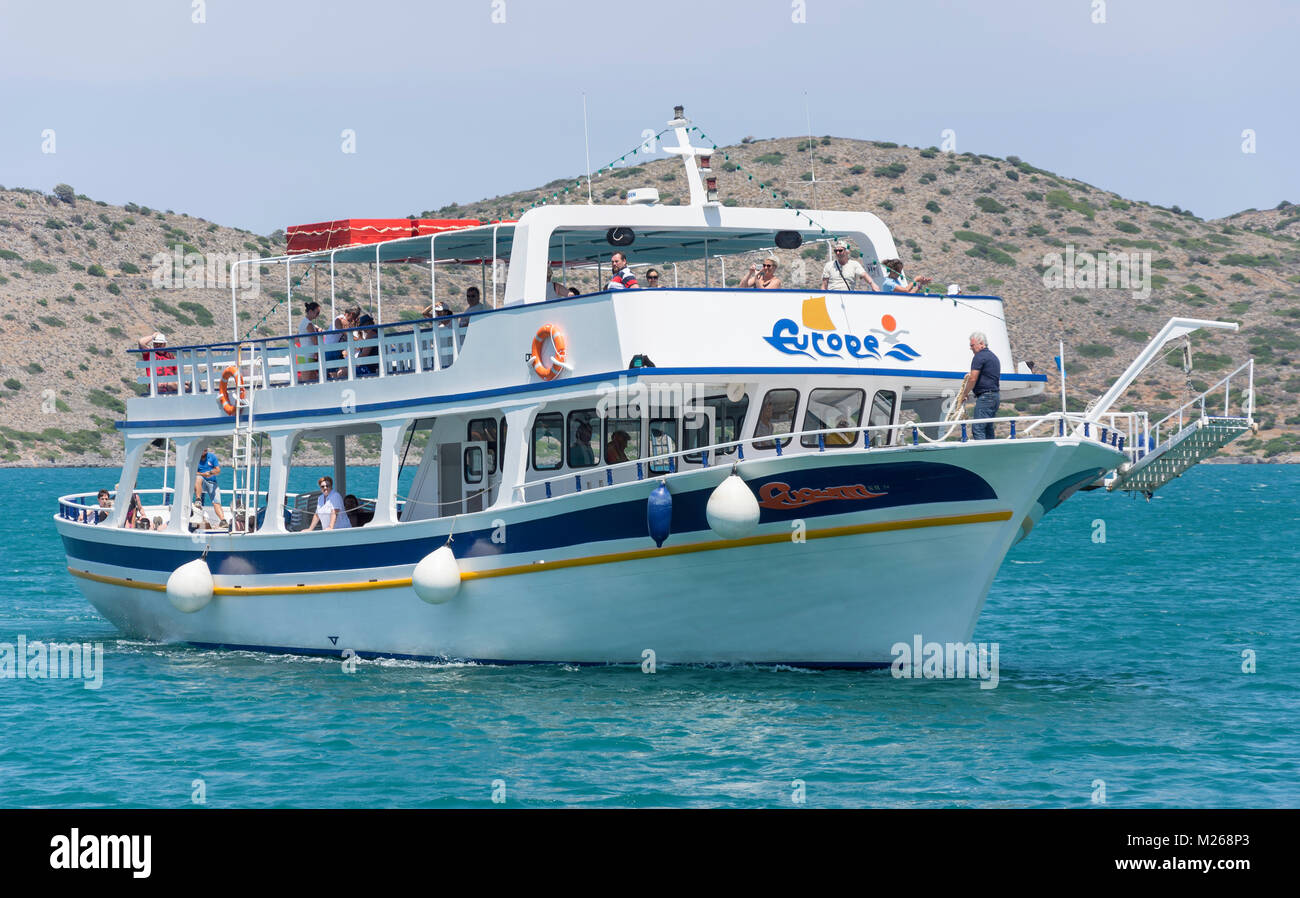 Excursion boat returning from Spinalonga, Elounda, Lasithi Region, Crete (Kriti), Greece Stock Photo